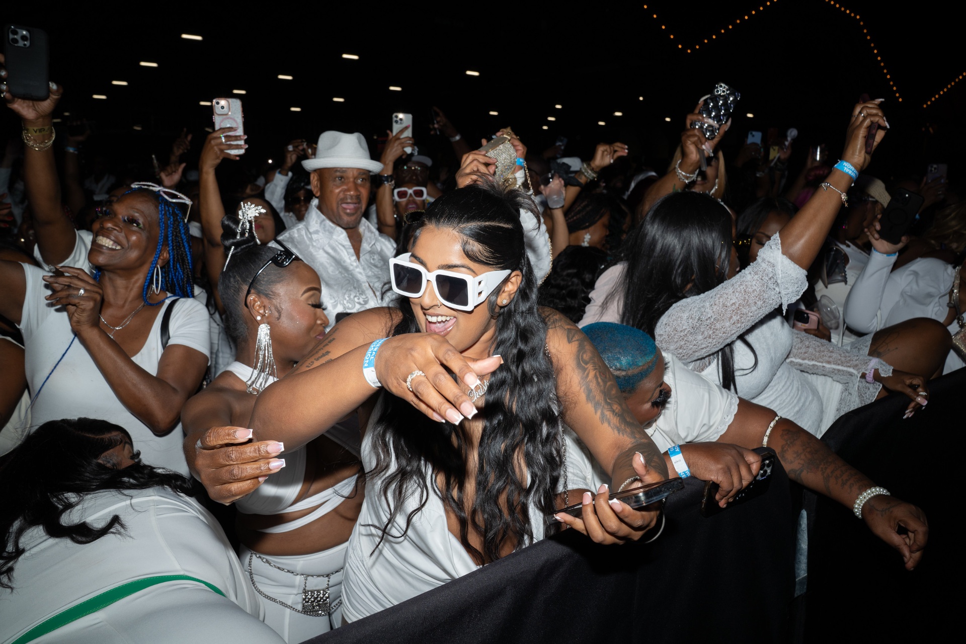 Young attendees near the stage smiling at a previous Foundation event